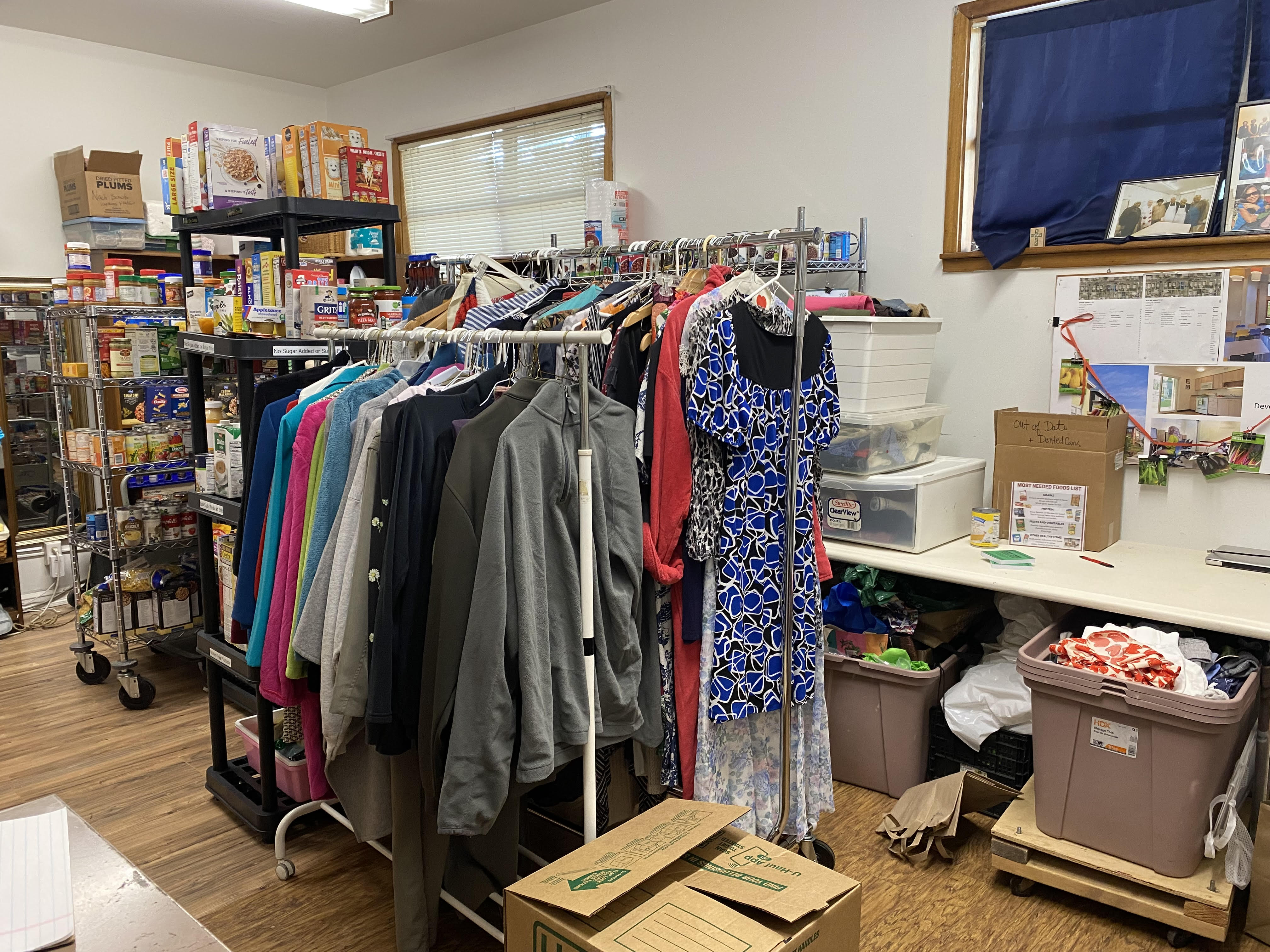 Image of two the many racks Women and missonary stores in the food pantry